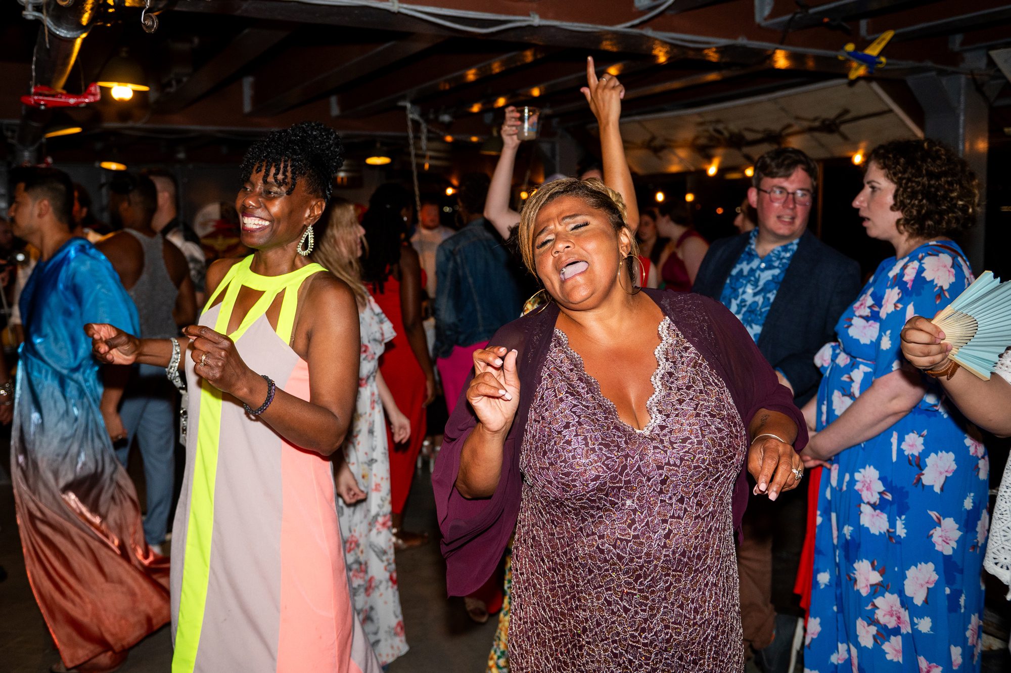 People dancing during a wedding reception on the Baylander. 