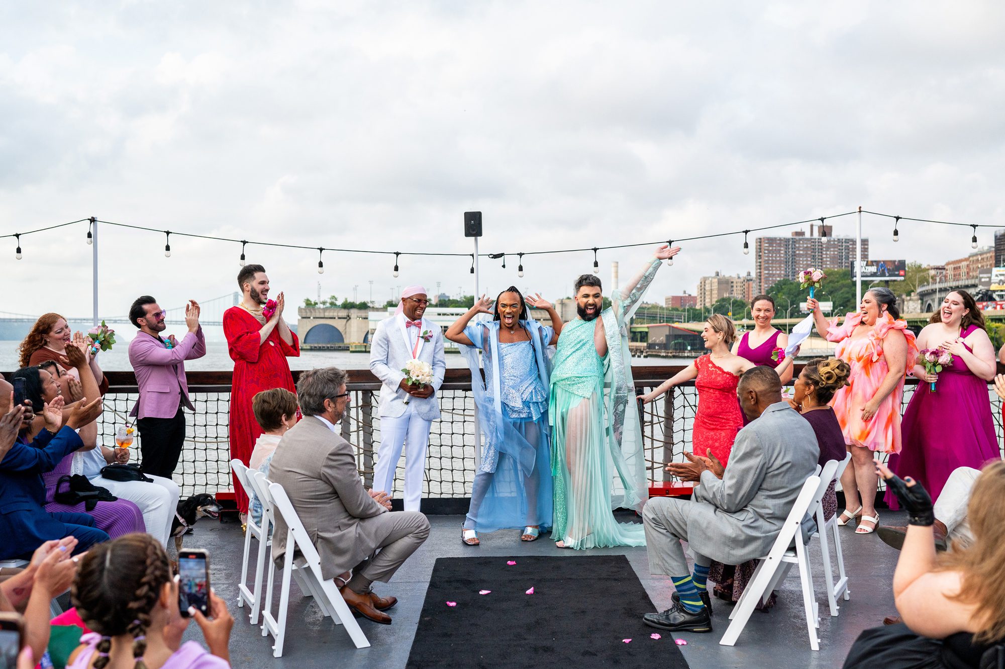 A couple cheering at the end of their New York wedding ceremony