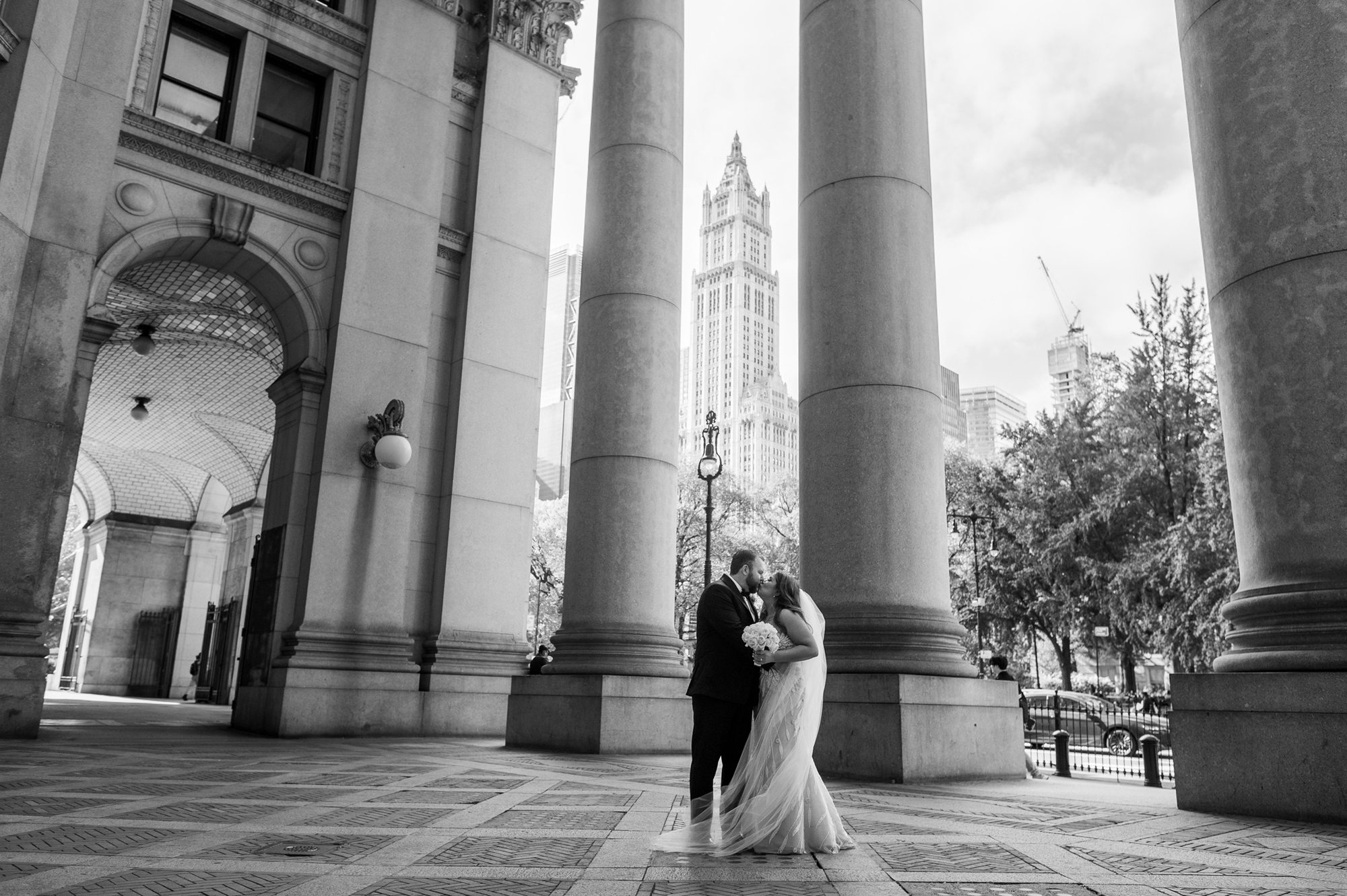 A couple kissing in black and white after their City Hall Elopement