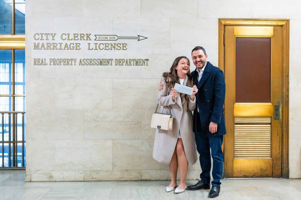 A couple waits outside the Brooklyn City Clerk's Offie for their NYC Elopement 