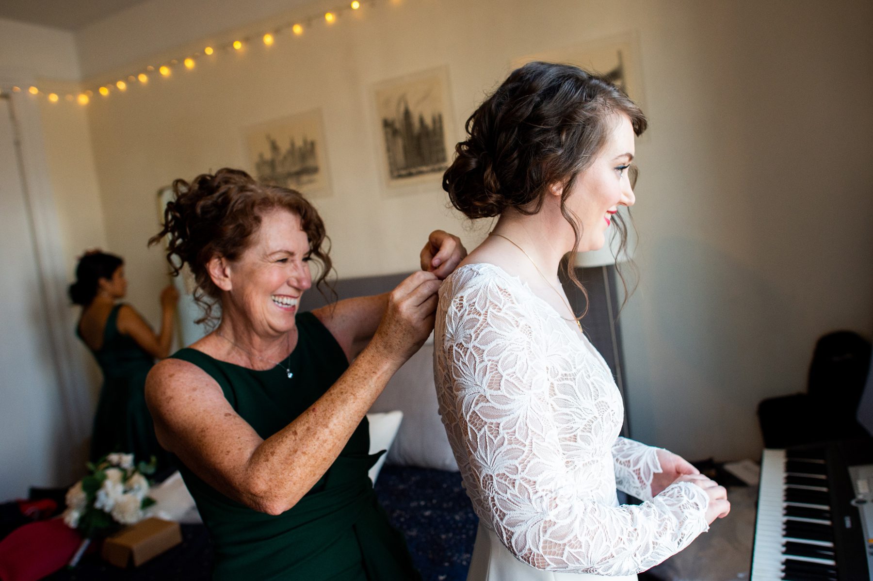 Mom Helping Bride into Dress 