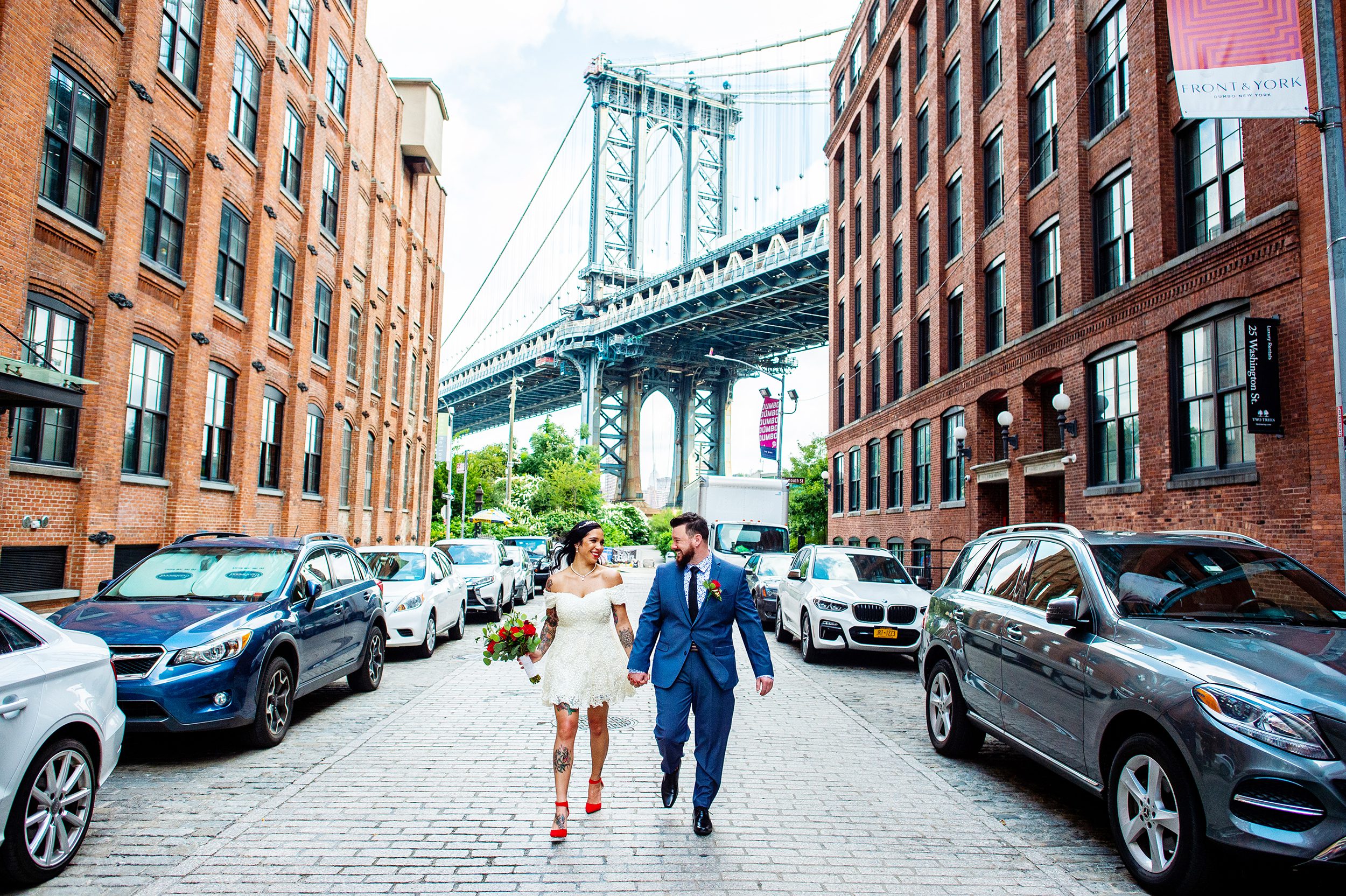 Couple walking down Washington Street after eloping in Brooklyn