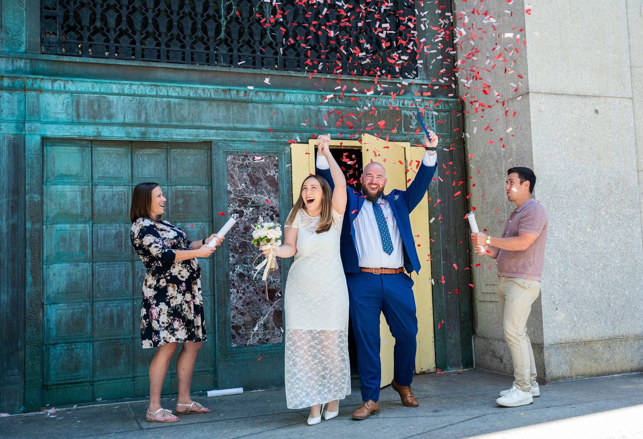 Couple exiting City Hall with confettii 