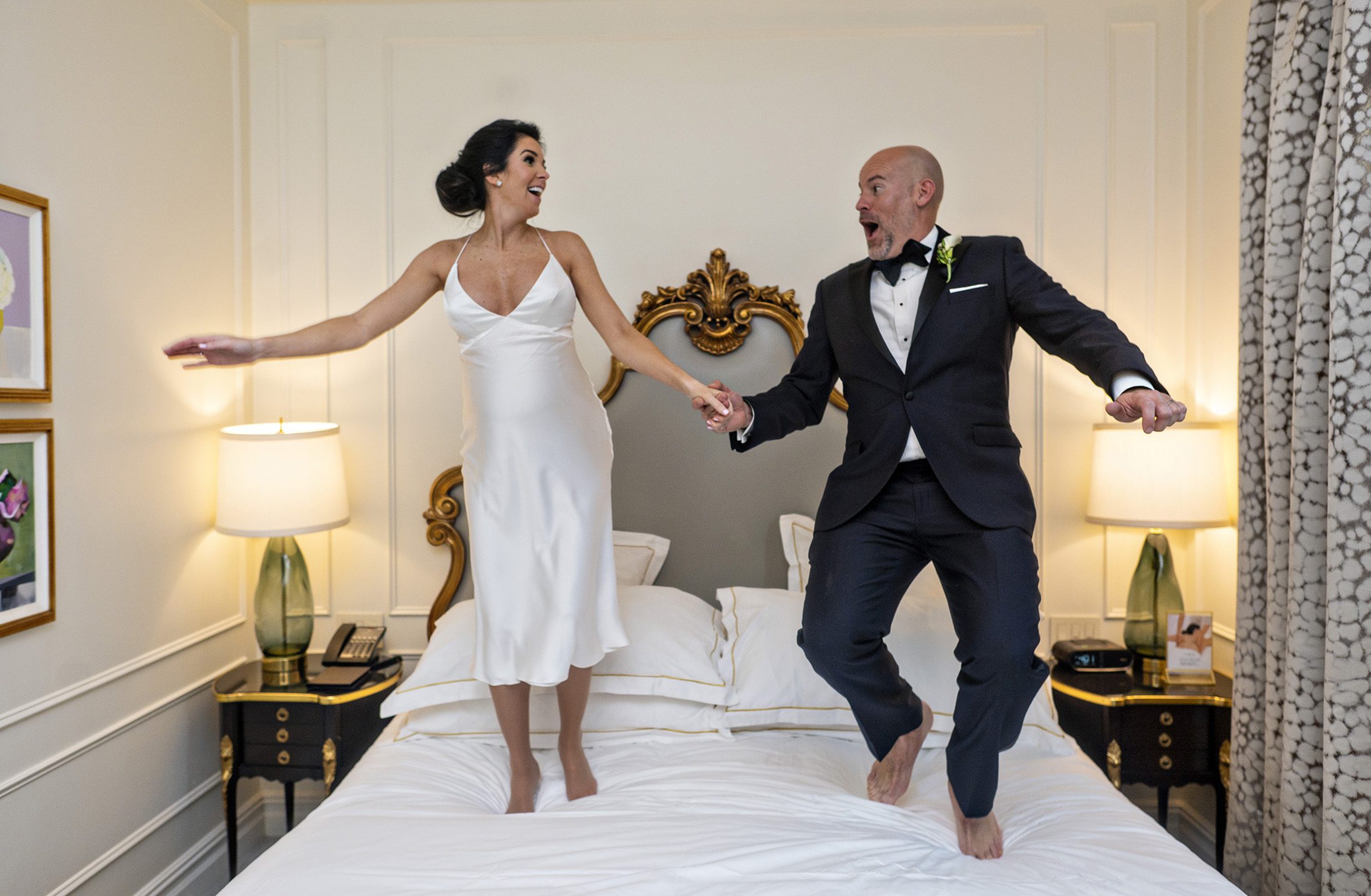 Bride and Groom Jumping on Bed at Plaza Hotel NYC
