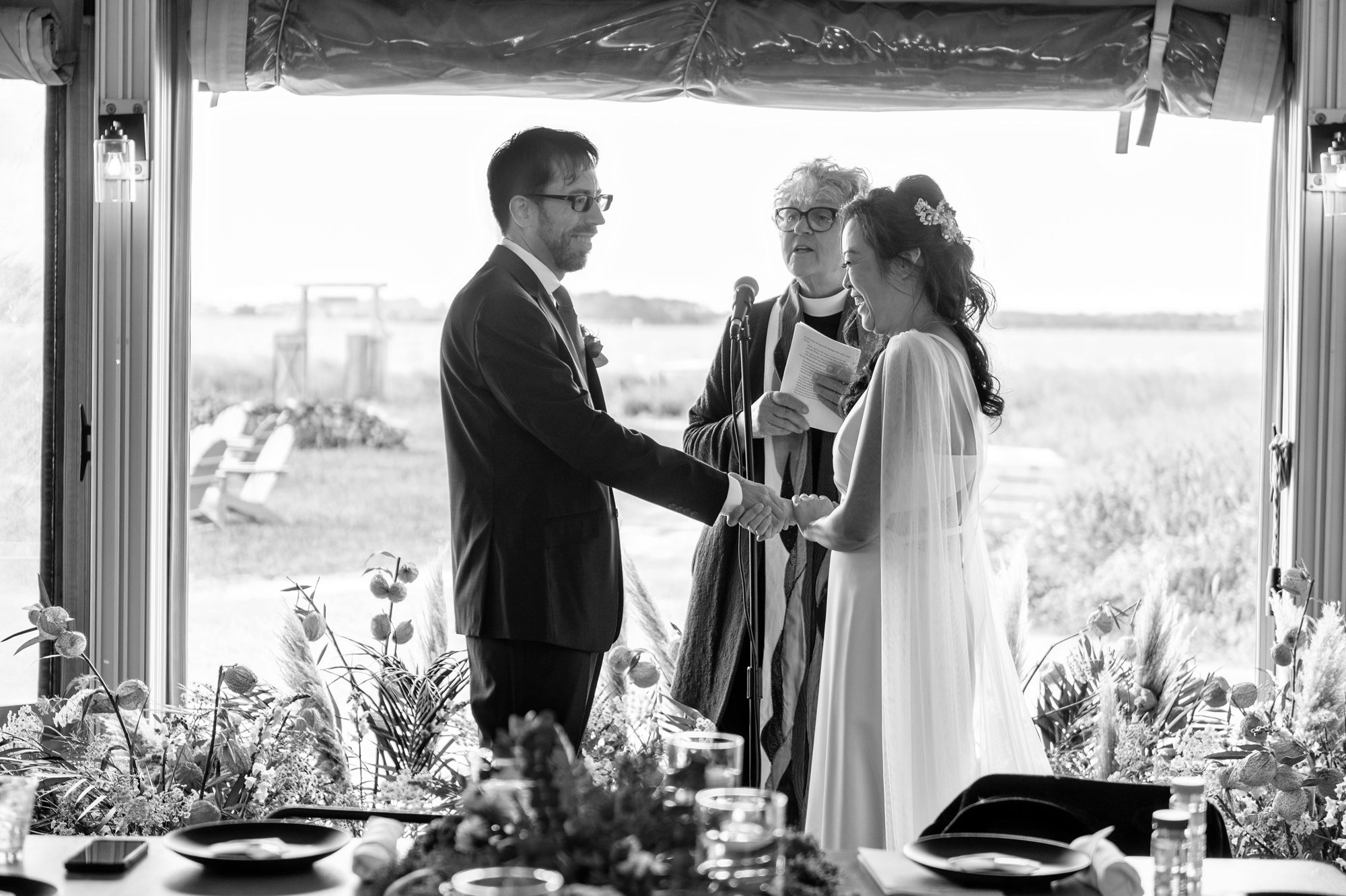 Black and white image of wedding ceremony at Collective Retreats