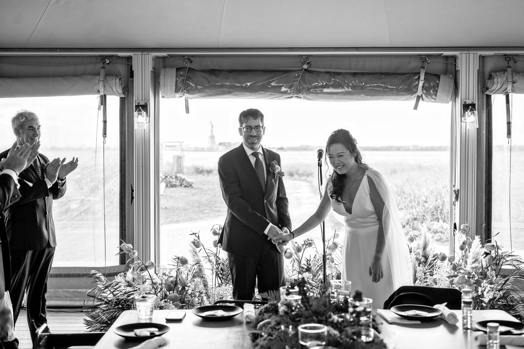 Black and white image of wedding ceremony at Governors Island in NYC