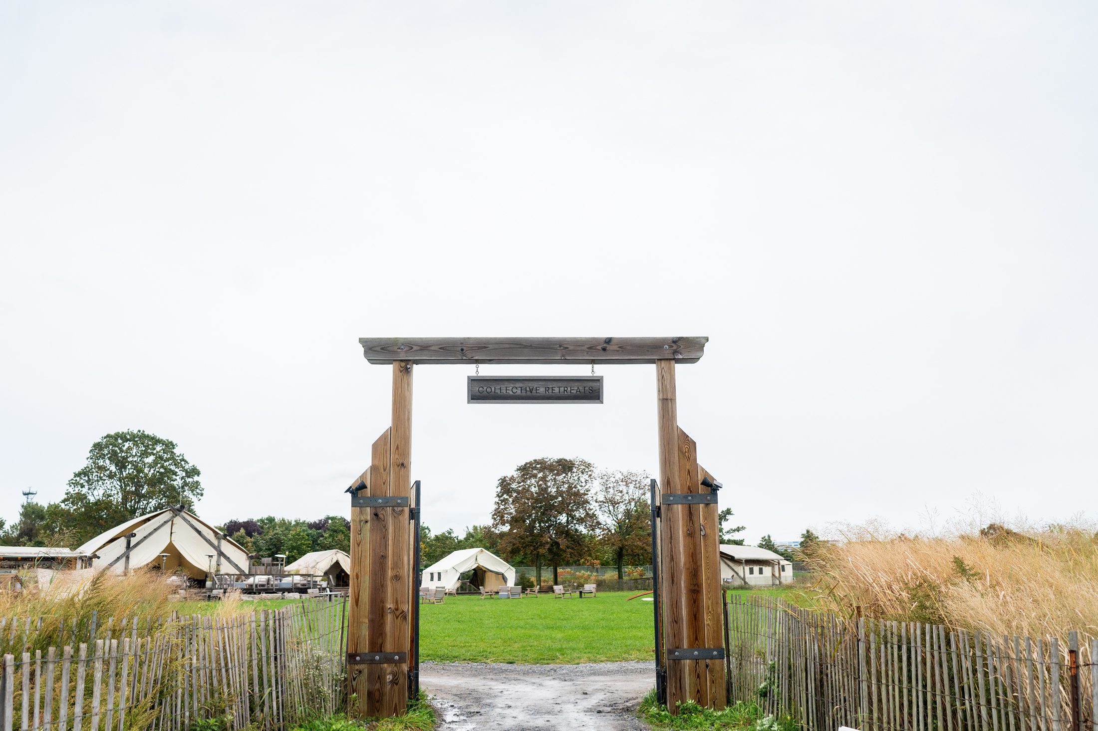 A view of the gate of Collective Retreats on Governors Island, a non traditional wedding venue in NYC