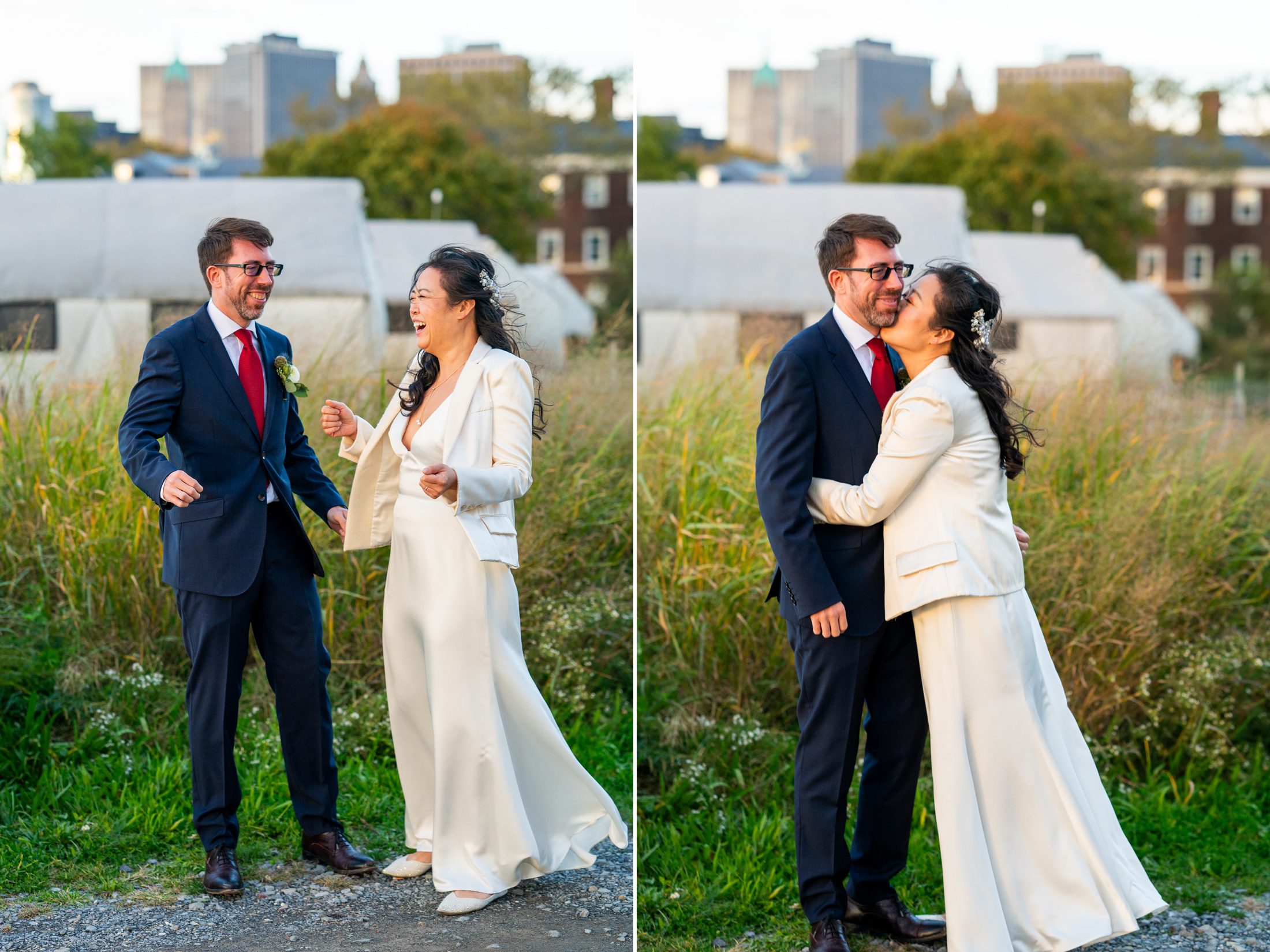 Bride and groom dancing and laughing in front of tall grass. 