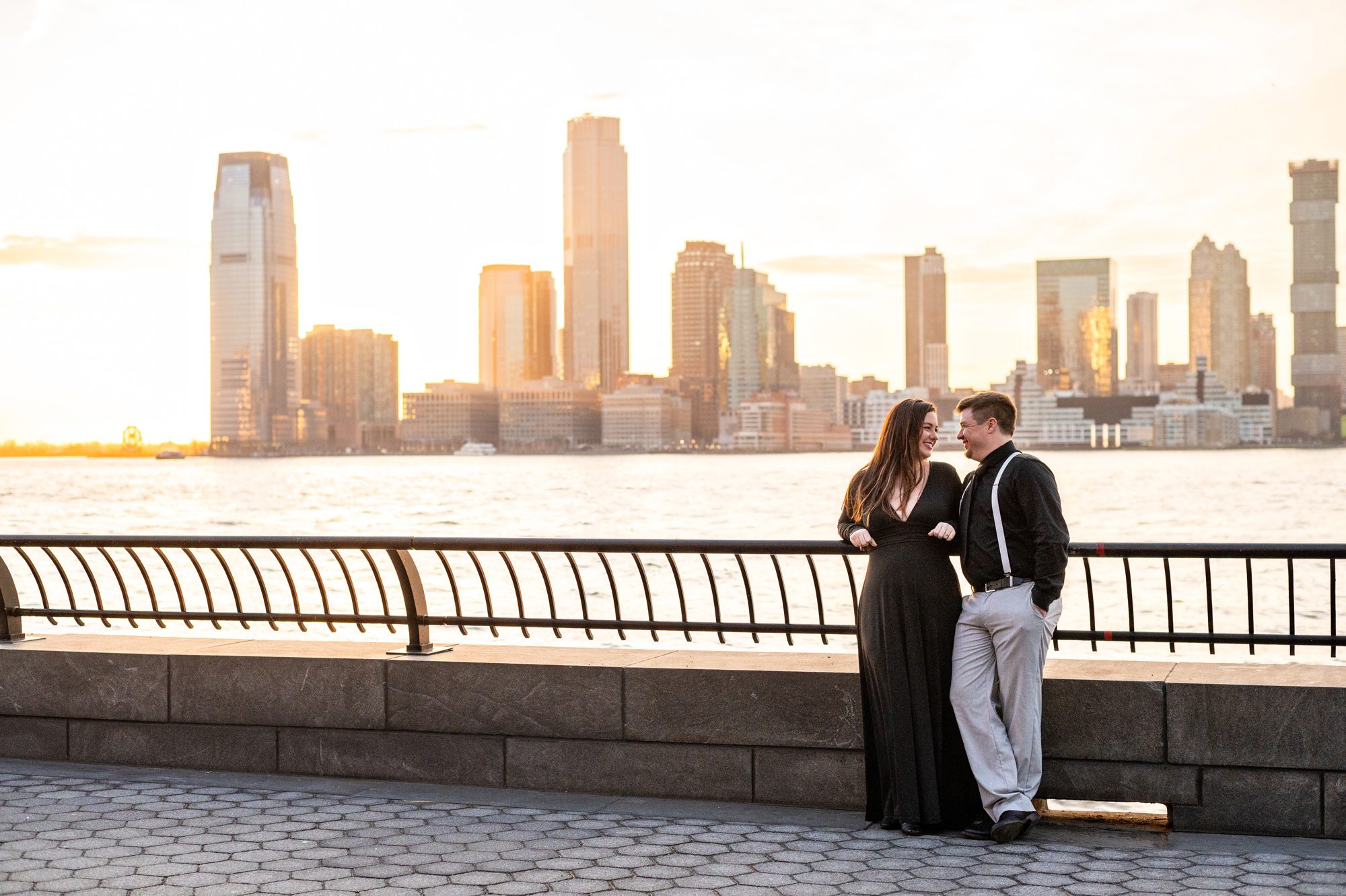 Couple at sunset on the Hudson river after eloping at City Hall in NYC