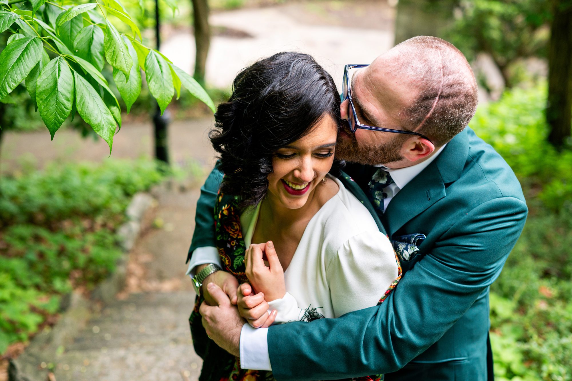 Bride and Groom taking wedding photos in Fort Tryon Park