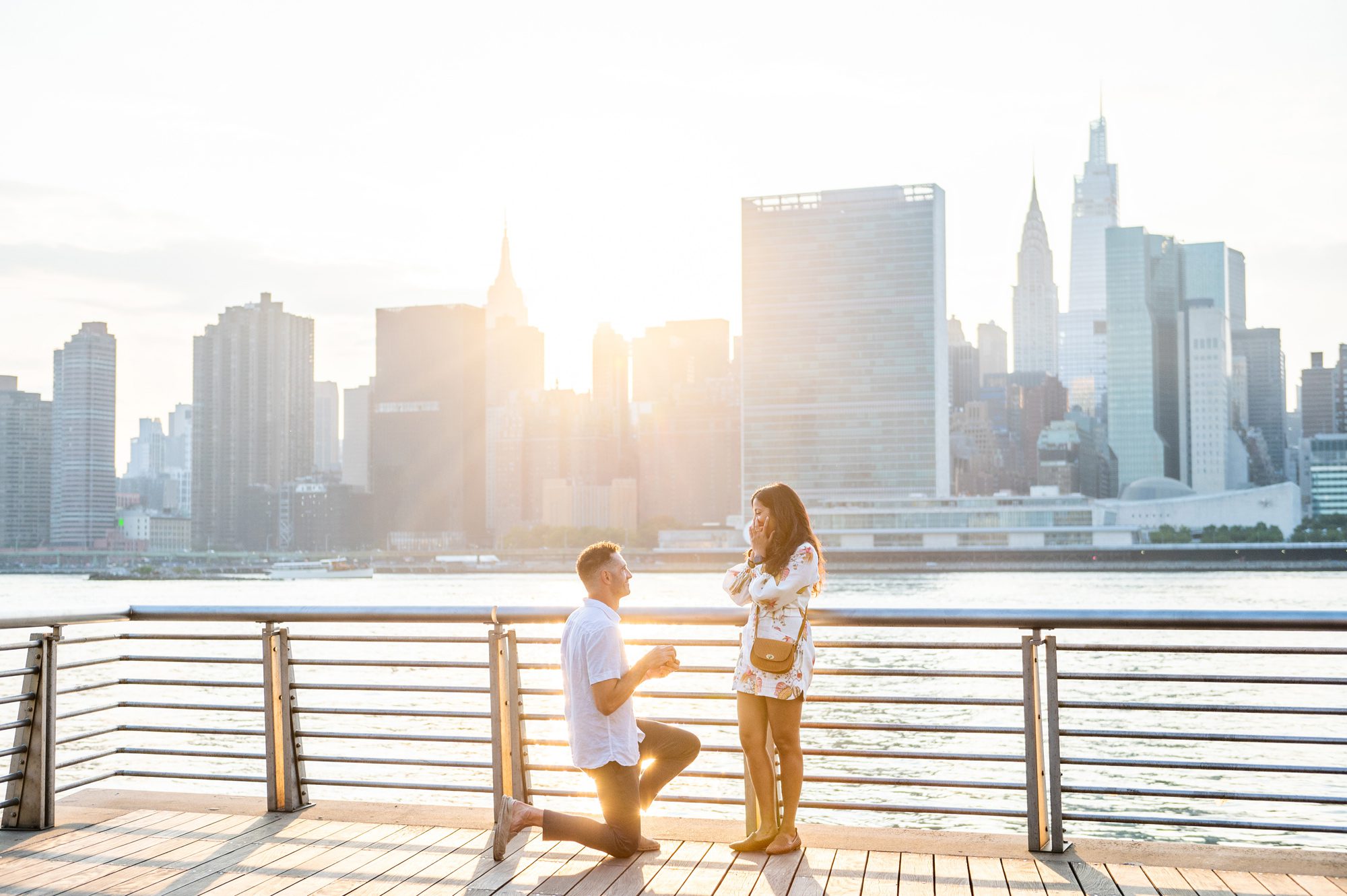 A marriage proposal in Gantry Park at sunset in NYC 