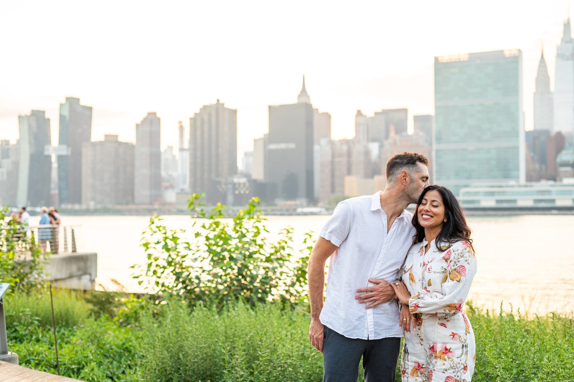Taking engagement photos in Gantry Park in Queens, NY