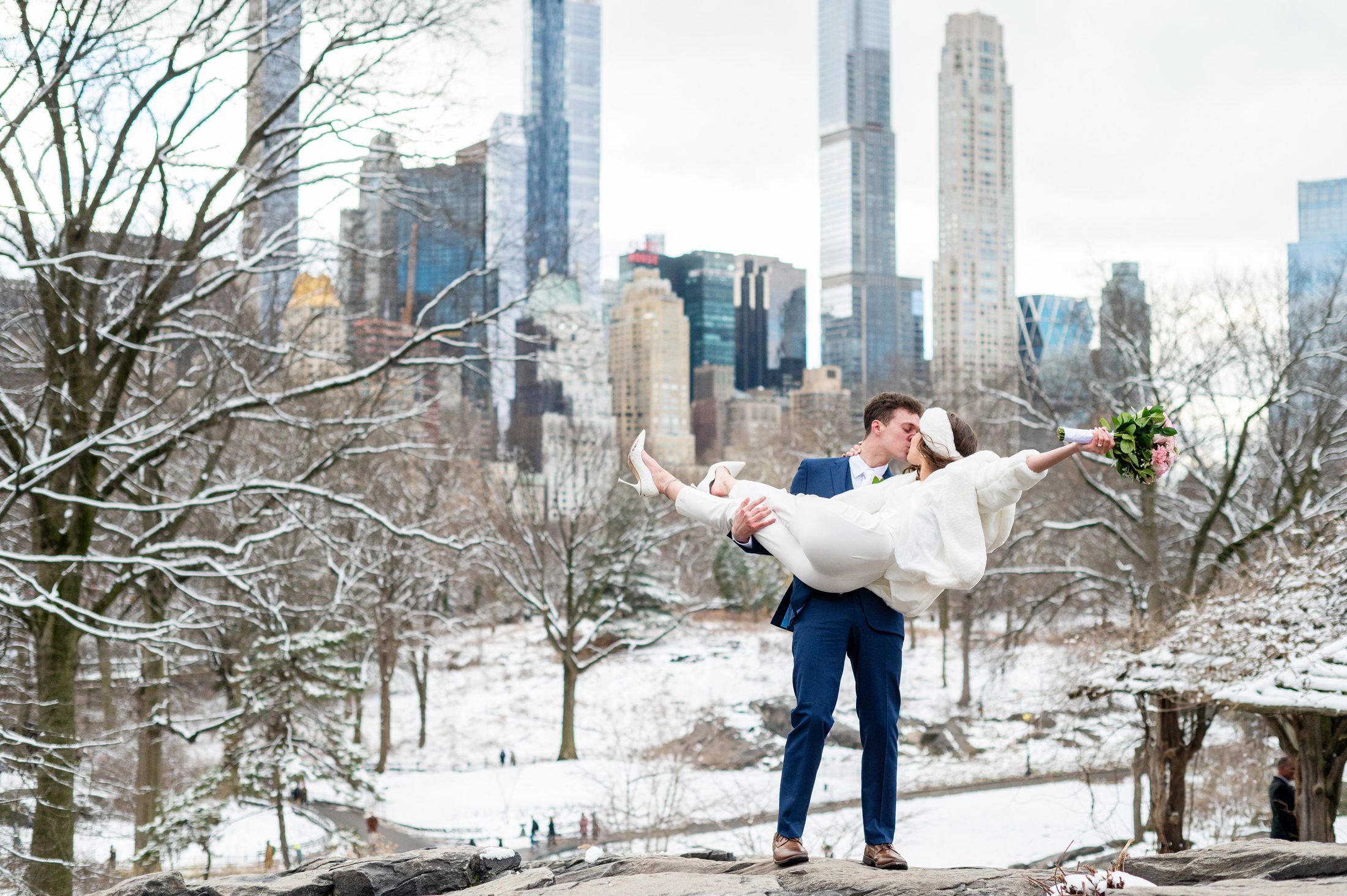Central Park winter wedding in the snow with bride and groom 