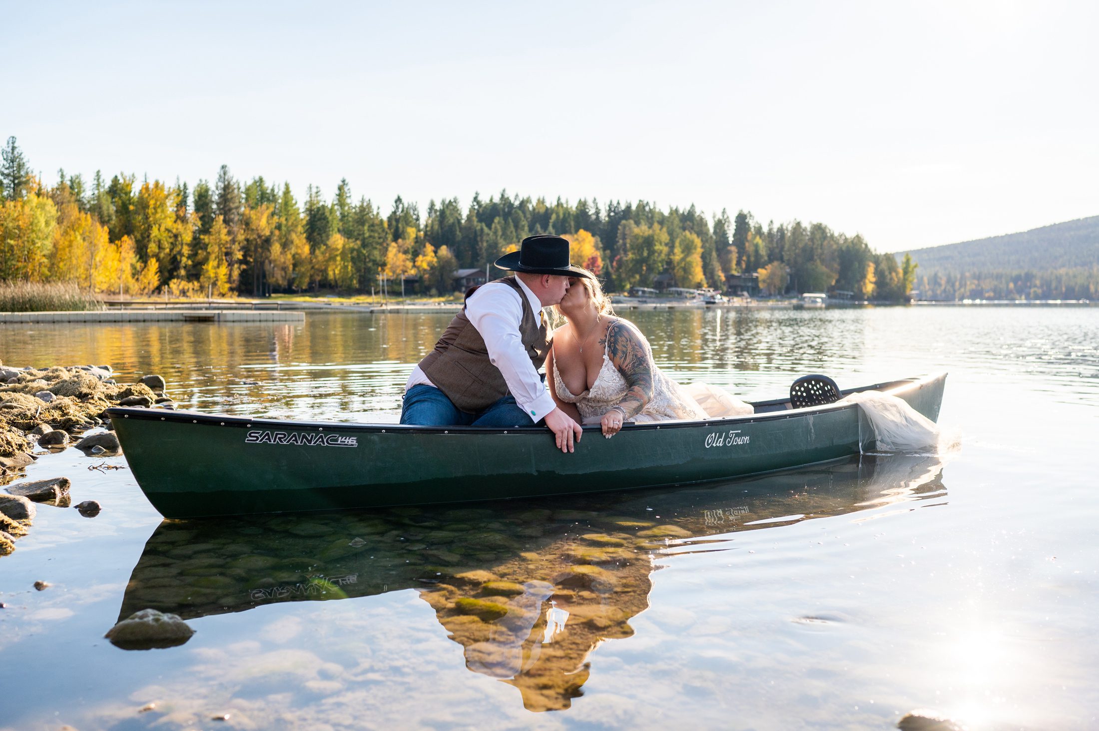 Wedding photos in a canoe at Lodge at Whitefish Lake 