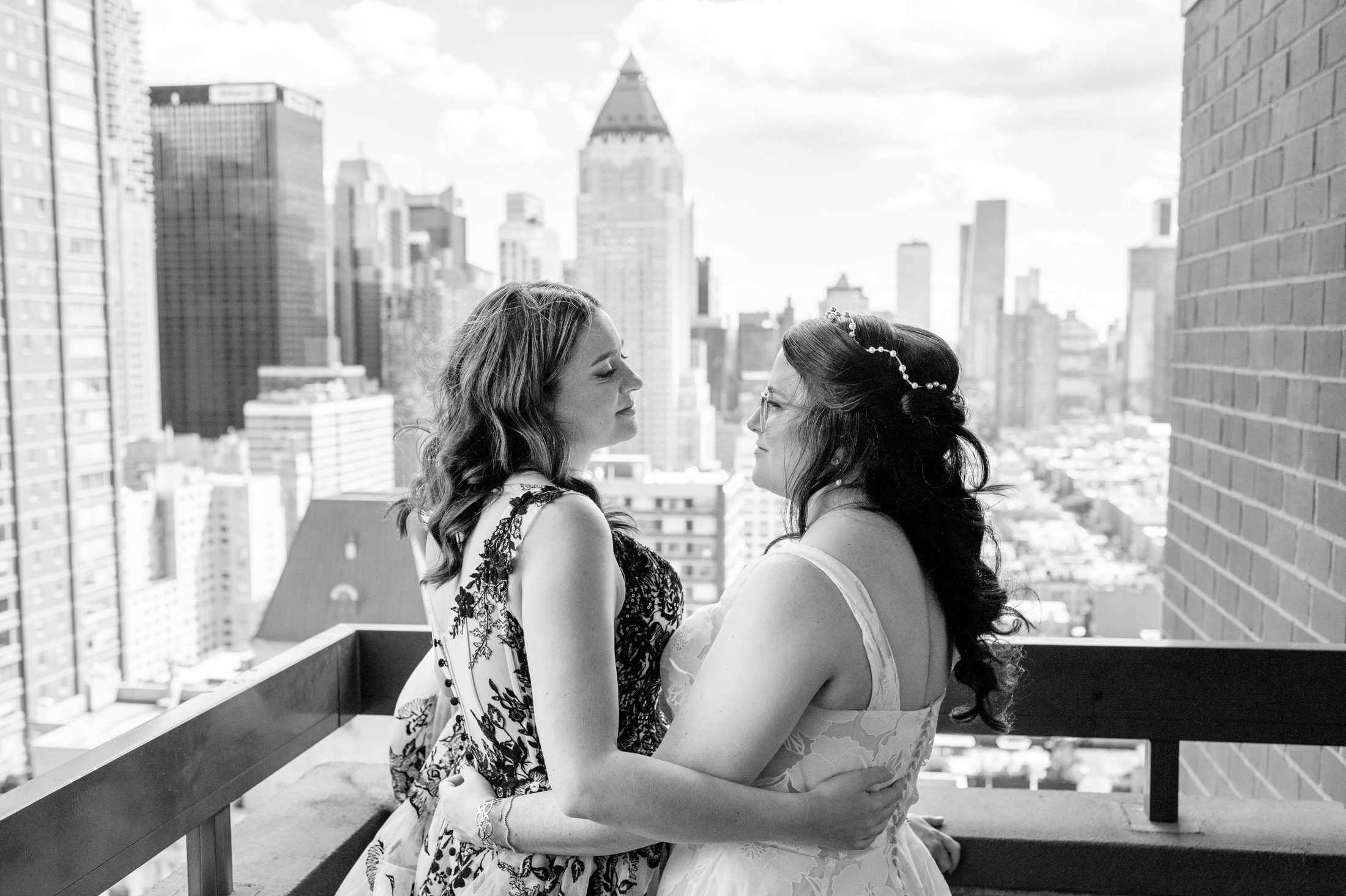 Two brides on a terrace in New York on their wedding day