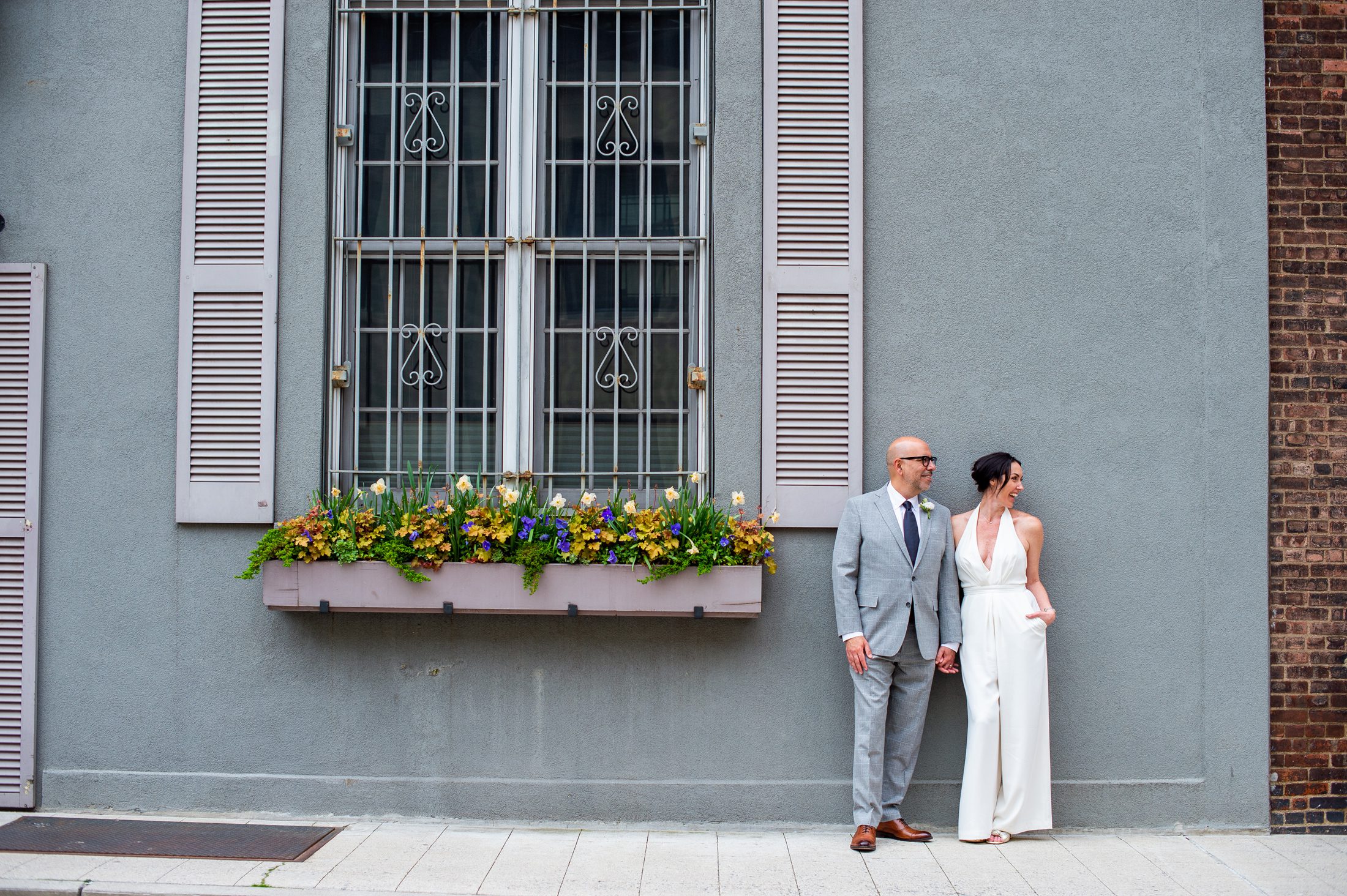 Bride and groom with bride wearing a pant suit for their nyc elopement