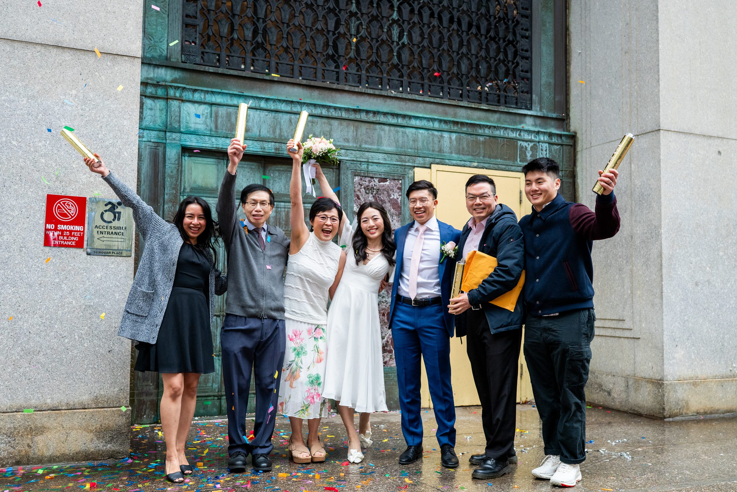 Couple with family after City Hall wedding in NYC