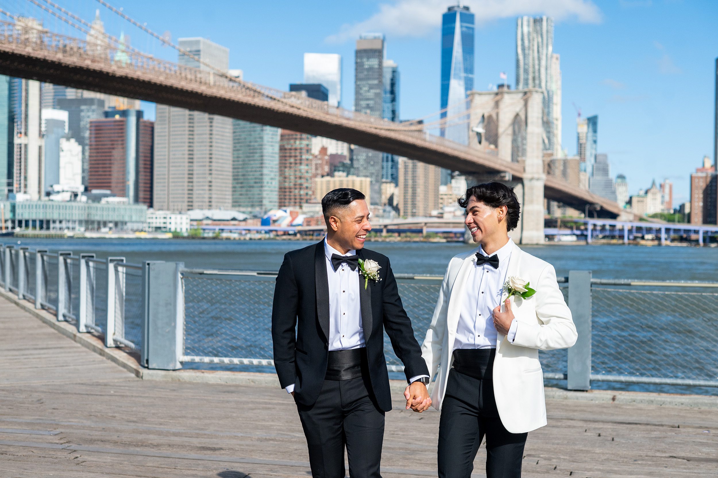 Two grooms smiling after eloping in Brooklyn 