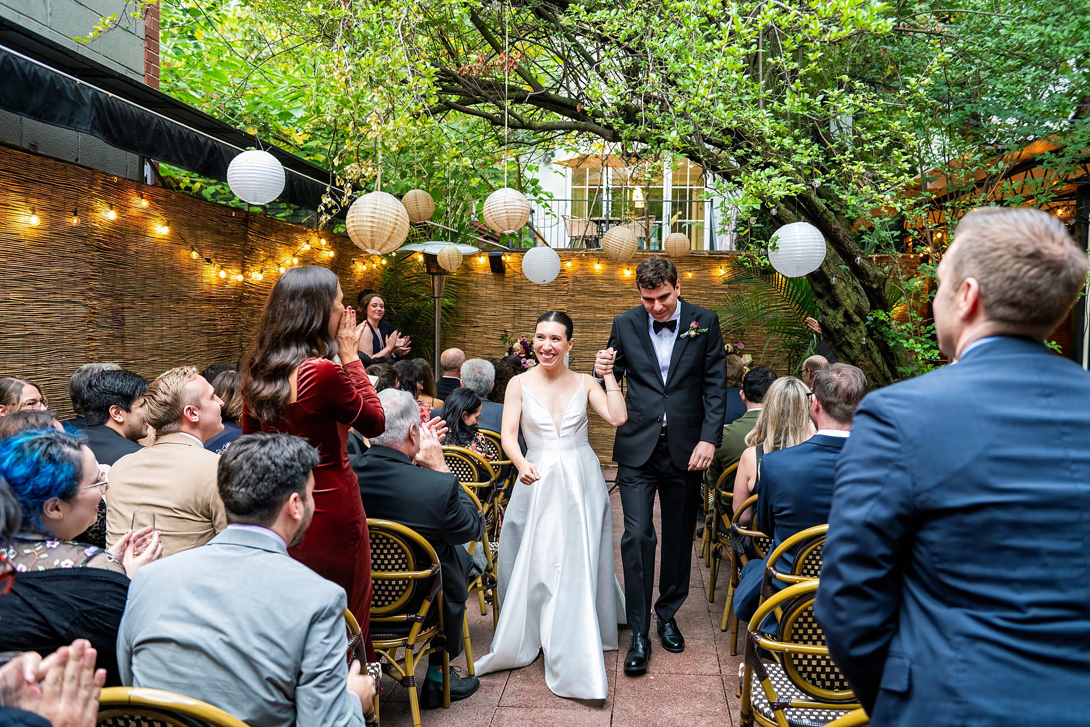 Wedding ceremony in a restaurant garden in Bacchus Bistro in Brooklyn 
