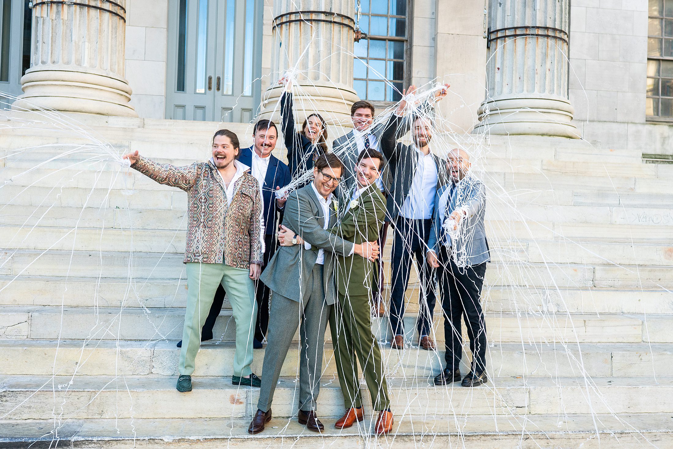 Gay couple with confetti after their Brooklyn City Hall Wedding