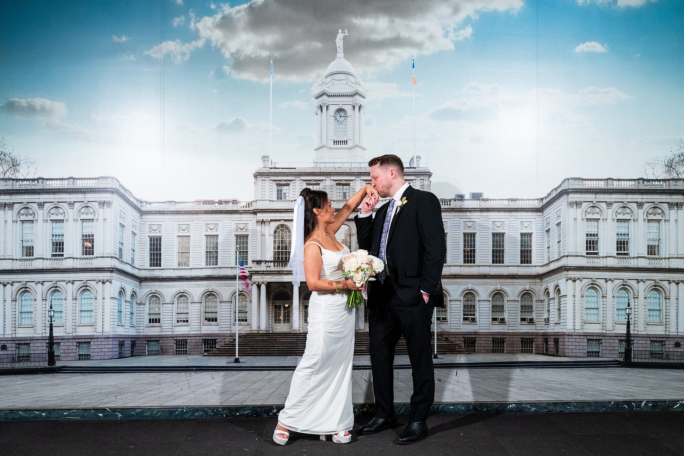 Photo with city hall backdrop at Manhattan courthouse wedding 