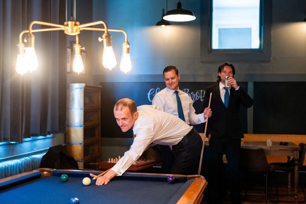 Groom playing pool at Venue 1902